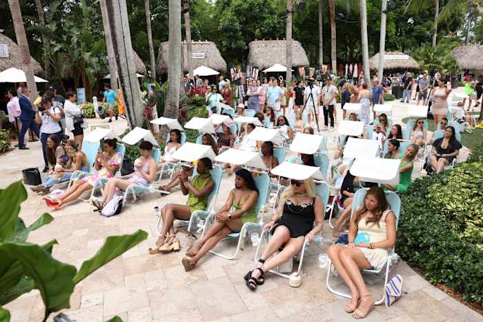 The crowd listening to SI Swimsuit panel discussions in Sunflow chairs at 2022 launch week.